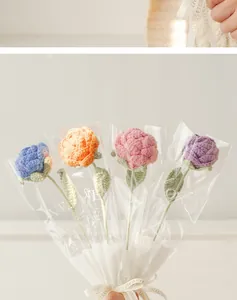 Close-up of handmade crochet flower bouquet with colorful roses and LOVE IS ETERNAL ribbon
