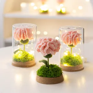 Handmade crochet pink carnation flower lamp in glass dome with warm LED lights and cork base
