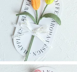 Detail of handmade crochet tulips with Love Is Eternal ribbon and elegant gift packaging
