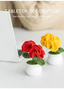 Macro view of handmade knit carnation flower pot with soft home decor background