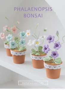 Detailed view of handmade knitted Phalaenopsis orchid bonsai with lace-trimmed pots