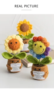 Close-up of handmade crochet sunflower pots with emotional support cards for desk decor