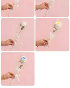 Hand-knitted crochet rose in transparent gift wrap with Love Is Eternal ribbon detail