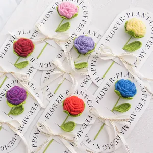 Handmade crochet rose bouquet with colorful yarn flowers and decorative ribbon bows