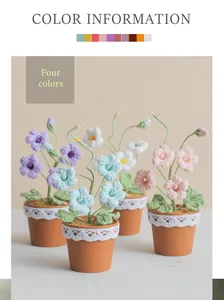 Detailed view of four handmade crochet freesia potted plants in various pastel colors