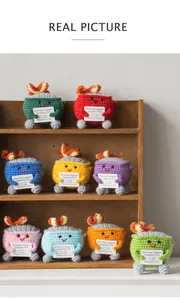 Row of colorful crochet dumpster fire dolls with emotional support cards on shelves