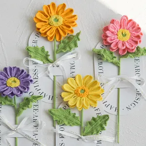 Handmade crochet gerbera flower bouquet with colorful petals and LOVE IS ETERNAL ribbon decoration