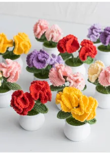 Detailed view of handmade crochet carnation potted plants in various vibrant colors