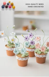 Detailed view of hand crocheted freesia potted plants with high-quality yarn materials
