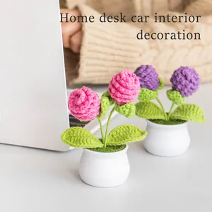 Handmade crochet pine cone potted plants in pink and purple for home and desk decor