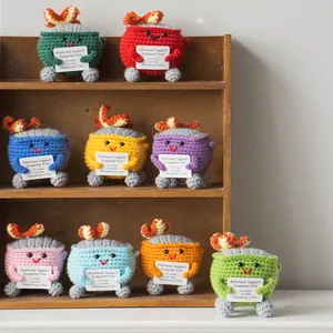Colorful emotional support dumpster fire crochet plushies with motivation cards