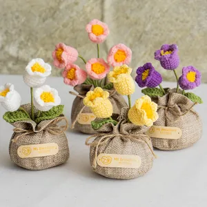 Detailed view of handmade crochet tulip potted flowers with burlap sack wrap packaging