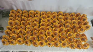 Detailed close-up of handmade crochet sunflower heads with intricate yellow yarn petals