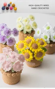 Detailed handmade crochet sunflower and daisy potted plants with vibrant wool textures