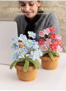 Handmade crochet forget-me-not potted plants in blue and pink for tabletop decoration