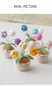 Macro detail of handmade crochet tulip potted flowers in vibrant multiple colors