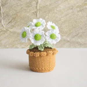Handmade crochet daisy potted plant with white flowers and green leaves for home decor