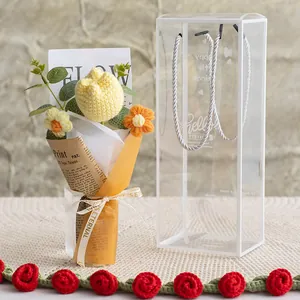 Handmade crochet tulip bouquet in vintage paper wrapping with a clear PVC gift tote bag