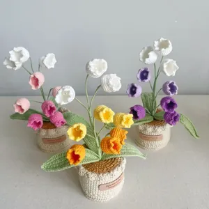 Handmade crochet lily of the valley potted plants in pink, yellow, and purple colors