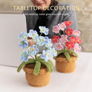 Handmade crochet forget-me-not potted plants in blue and pink for tabletop decoration