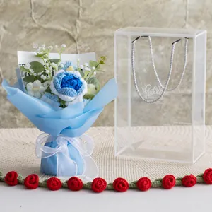 Handmade crochet rose bouquet in blue and white within a clear luxury gift box