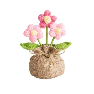 Handmade crochet puff flower potted plant in burlap bag for home desktop decoration