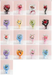 Multiple styles of handmade crochet flower bouquets in transparent PVC gift bags with ribbons