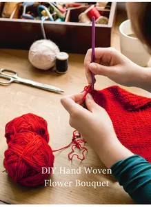 Detail of DIY hand woven flower bouquet showing purple crochet hook with red yarn