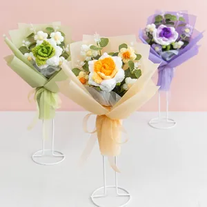 Handmade knitted flower bouquet set with roses and tulips in colorful gift packaging
