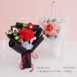 Handmade crochet red rose bouquet in black gift paper with transparent carrier bag