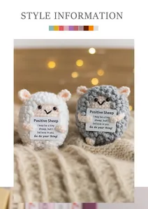Detail of handmade knit sheep with motivational positive quote card in white and grey