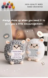 Detailed view of hand-crocheted positive sheep dolls with encouraging cards and wool texture