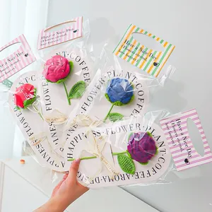 Detailed view of handmade crochet rose bouquets in colorful premium gift packaging wraps
