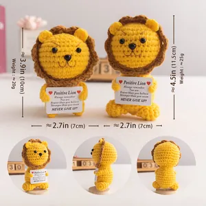 Handmade crochet lion amigurumi doll with positive quote card for desktop decor
