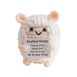 Cute knitted white sheep doll with motivational card and creative crochet texture