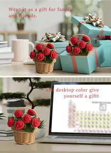 Detailed view of hand-knitted red roses in a small basket for office desktop decor