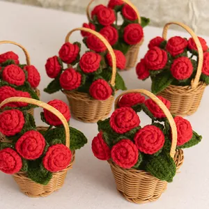 Handmade crochet red rose flower baskets in brown woven pots for desktop decoration