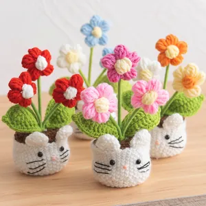 Handmade crochet puff flower pot with colorful knitted blossoms and cute cat face base