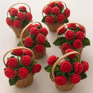 Handmade knitted red rose bouquet in a small woven basket for tabletop decor