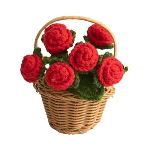 Handmade crochet red rose bouquet in a woven brown basket for desktop decor