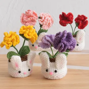 Handmade knitted rabbit carnation potted plant decoration in colorful wool yarn finish