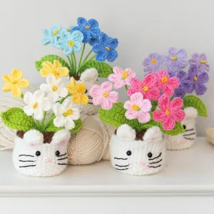 Handmade crochet forget-me-not potted flower in cat shaped base for desk decor