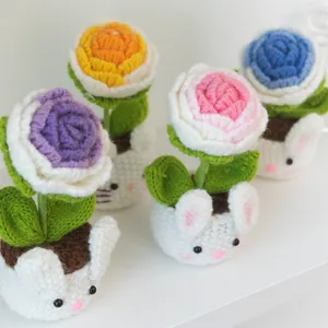 Handmade knitted rose bonsai set featuring cute bunny-shaped pots and colorful yarn flowers