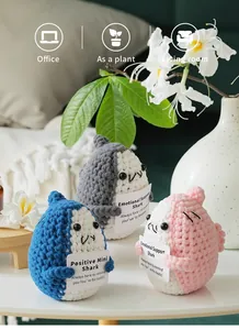 Detailed texture of handmade crochet sharks with emotional support encouraging cards