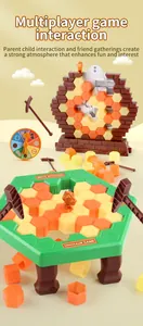 Close-up of dinosaur ice breaking board game set with hammers and colorful hexagonal blocks
