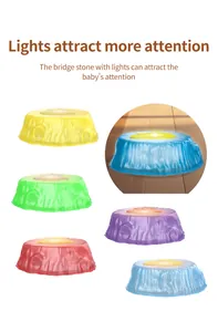 Close-up of colorful light-up sensory bridge stones with realistic wood grain texture