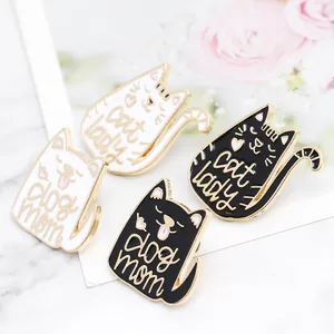 Cute Cat Lady and Dog Mom enamel pins set with heart detail on a marble surface