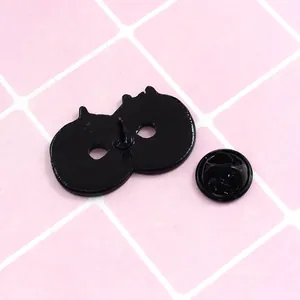 Infinity symbol donut badge back view with double pin and black metal alloy finish