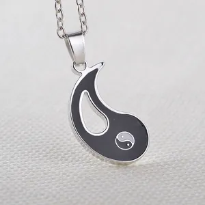 Detail of Yin Yang Best Friends necklace with black enamel pendant and silver chain