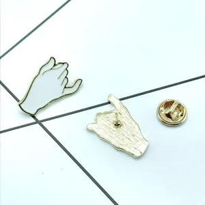 Detailed front and back view of enamel pinky swear brooch with gold butterfly clutch